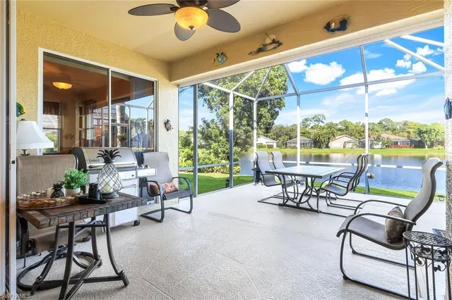 a building outdoor space with patio furniture and potted plants