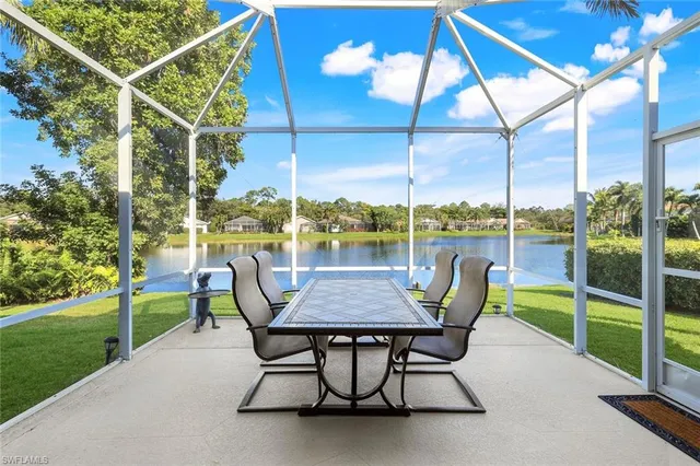 a table and chairs sitting in the park
