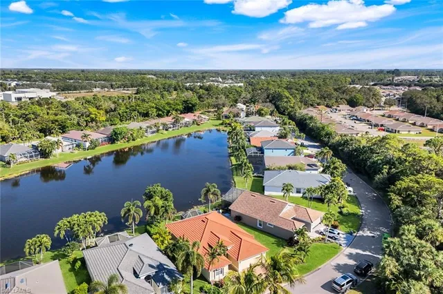 an aerial view of a house with a lake view