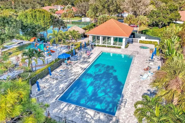 a view of a city with lots of trees and flowers