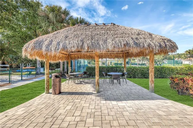 a view of a backyard with sitting area