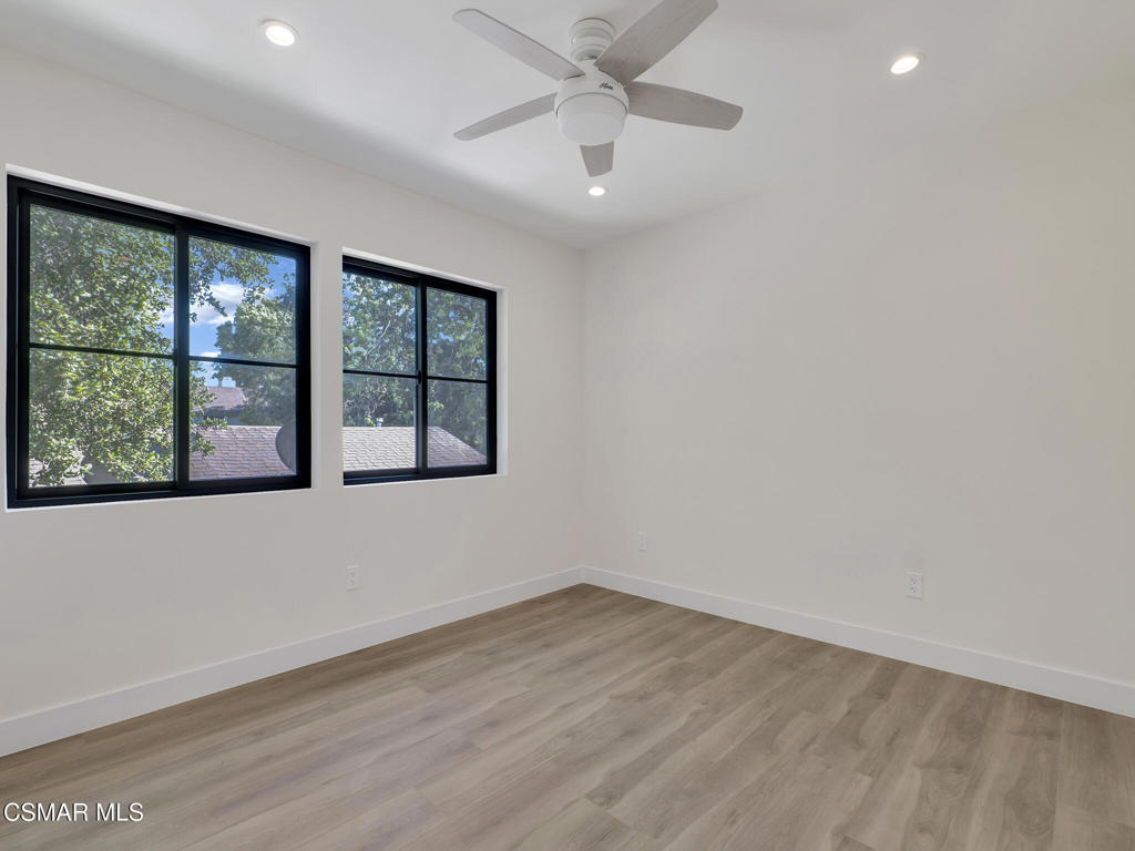 3190 Los Robles Road, Unit B Thousand Oaks, CA 91362 - Photo 15 of 21 an empty room with wooden floor and windows