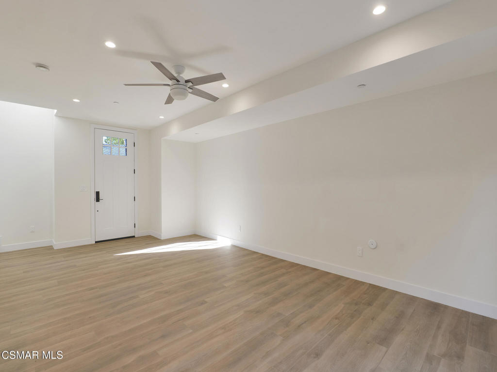 3190 Los Robles Road, Unit B Thousand Oaks, CA 91362 - Photo 3 of 21 an empty room with wooden floor ceiling fan and windows