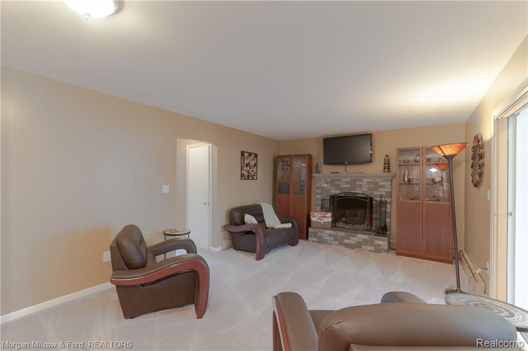 6490 Waldon Road Clarkston, MI 48346 - Photo 23 of 37 Family room w/ wood burning fireplace