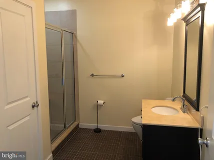 a bathroom with a sink and mirror