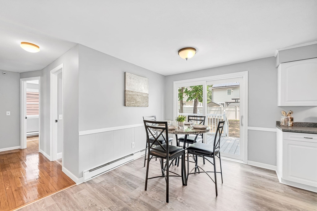 17 Delmore Street Springfield, MA 01109 - Photo 17 of 42 a view of a dining room with furniture and wooden floor