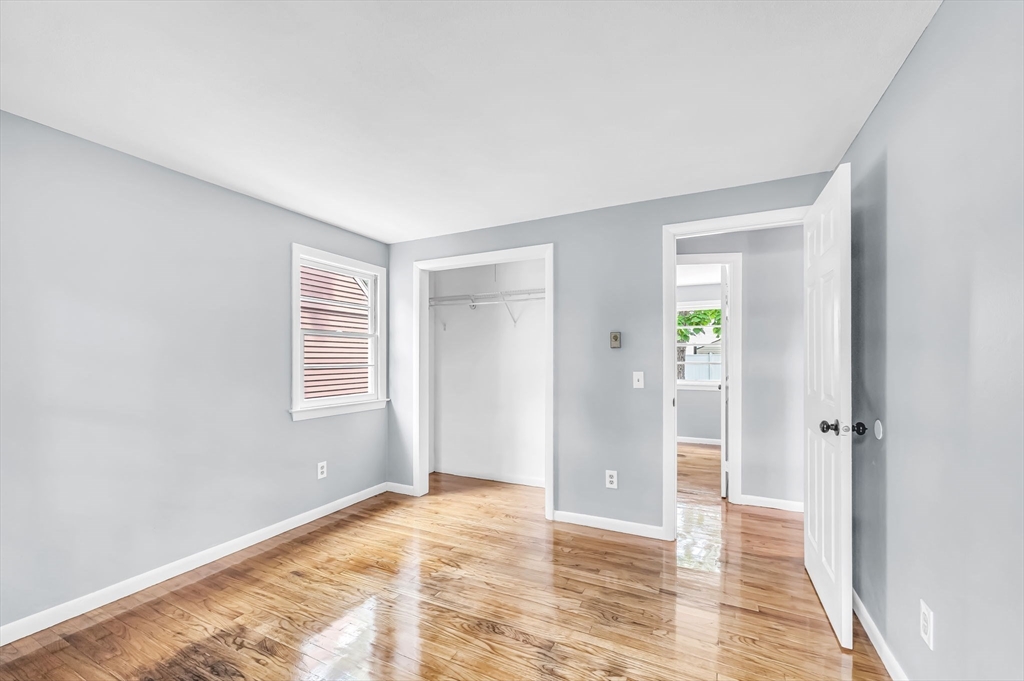 17 Delmore Street Springfield, MA 01109 - Photo 21 of 42 a view of an empty room with wooden floor and a window