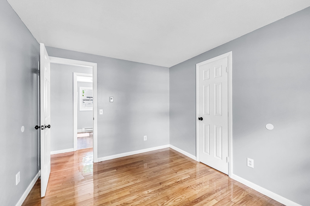 17 Delmore Street Springfield, MA 01109 - Photo 26 of 42 wooden floor in an empty room