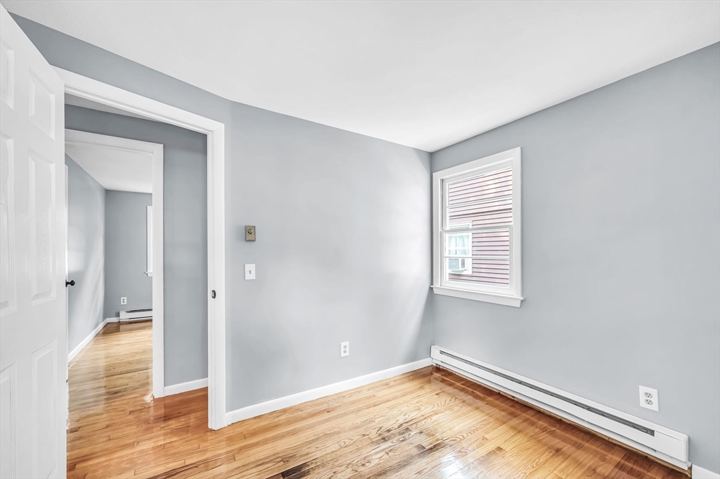 17 Delmore Street Springfield, MA 01109 - Photo 29 of 42 a view of empty room with wooden floor