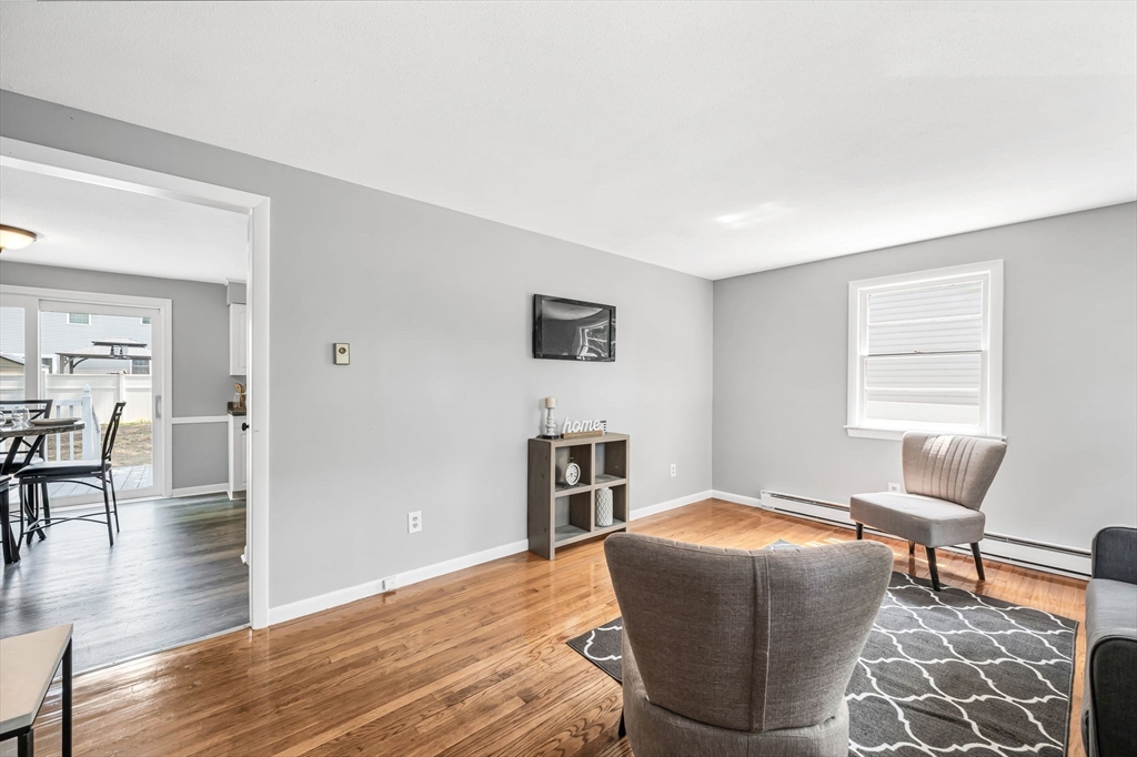 17 Delmore Street Springfield, MA 01109 - Photo 8 of 42 a bedroom with furniture and a window