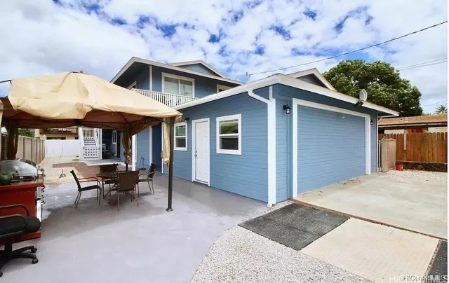 a front view of a house with sitting space and seating space