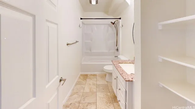 a bathroom with a tub shower and a sink