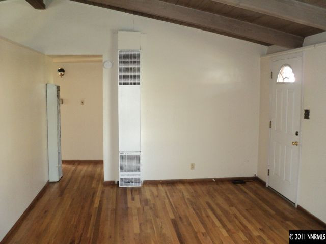 740 Reeves Avenue Reno, NV 89503 - Photo 6 of 9 a view of an empty room with wooden floor and a window