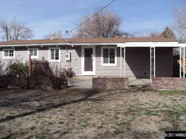 740 Reeves Avenue Reno, NV 89503 - Photo 8 of 9 a front view of a house with a yard and potted plants