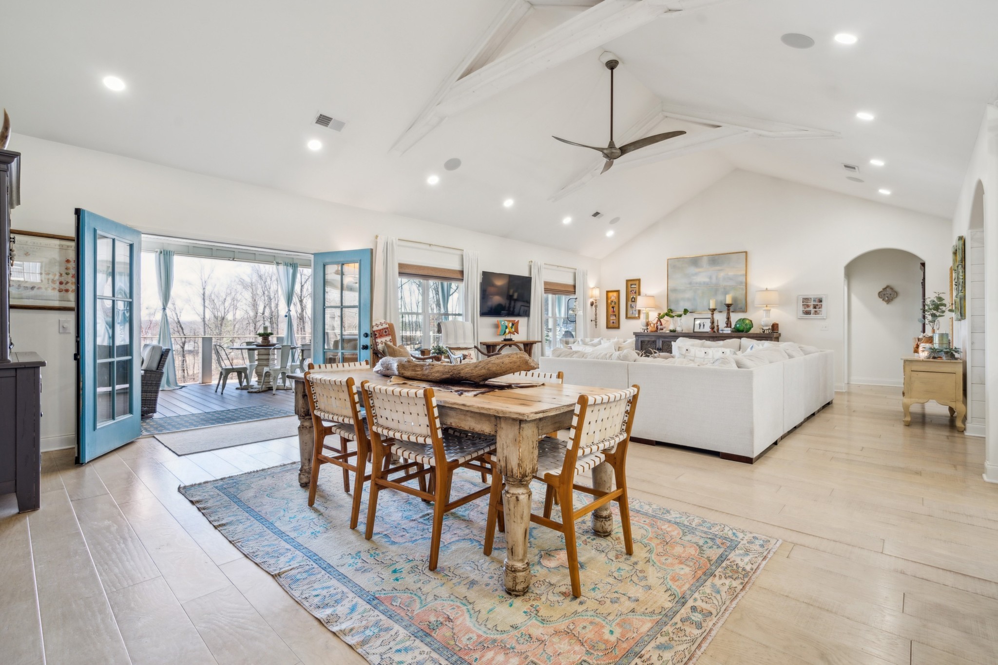 a large kitchen with a table and chairs