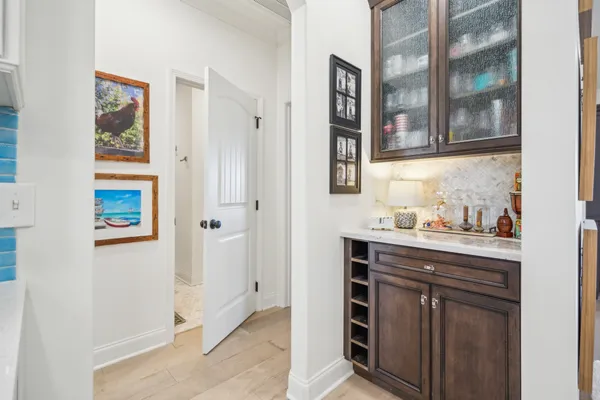a living room with furniture a large window and a flat screen tv