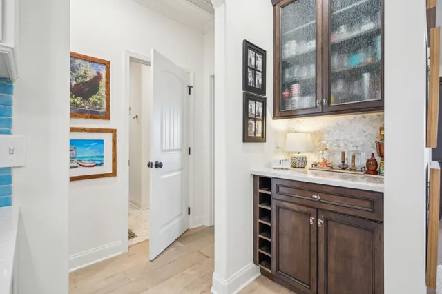 a living room with furniture a large window and a flat screen tv