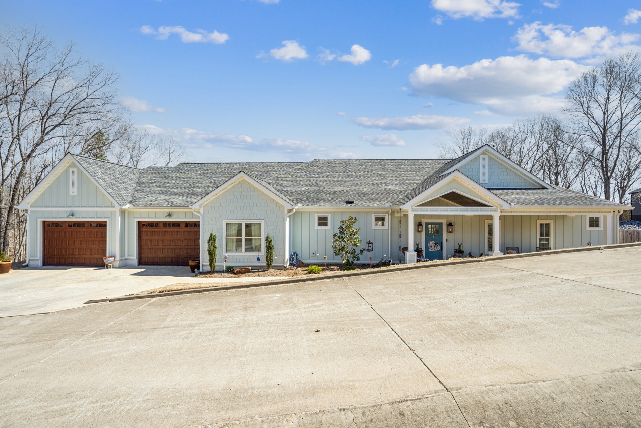 15 Barbara Road Buchanan, TN 38222 - Photo 2 of 35 a front view of a house with a yard and garage