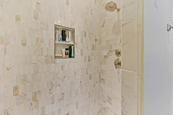 a utility room with cabinets washer and dryer