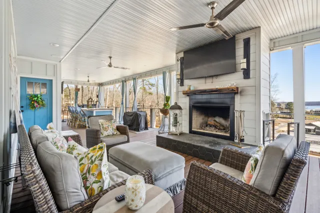 a living room with furniture and a floor to ceiling window