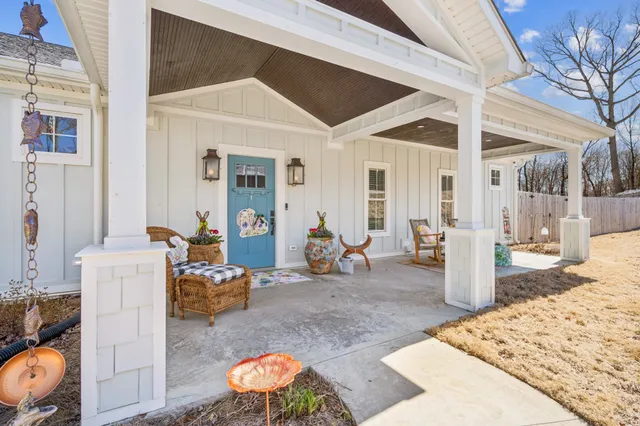a bedroom with furniture and a wooden floor