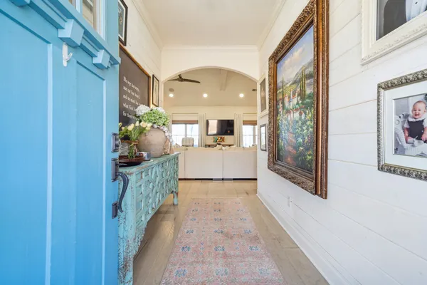 a large kitchen with a table and chairs