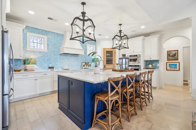 a kitchen with cabinets a sink and appliances
