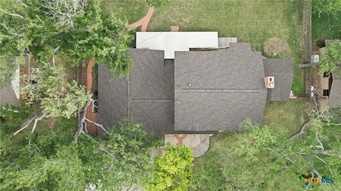 1903 North Harding Avenue Cameron, TX 76520 - Photo 41 of 44 a brick house with a yard and plants