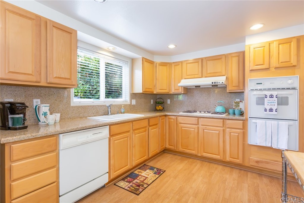 25610 Fallenleaf Drive Torrance, CA 90505 - Photo 14 of 49 a kitchen with granite countertop cabinets stainless steel appliances a sink and a window