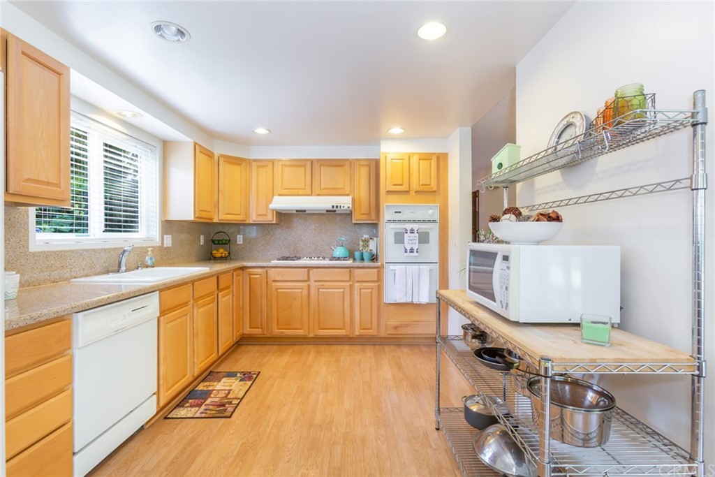 25610 Fallenleaf Drive Torrance, CA 90505 - Photo 15 of 49 a kitchen with stainless steel appliances granite countertop a sink stove and refrigerator
