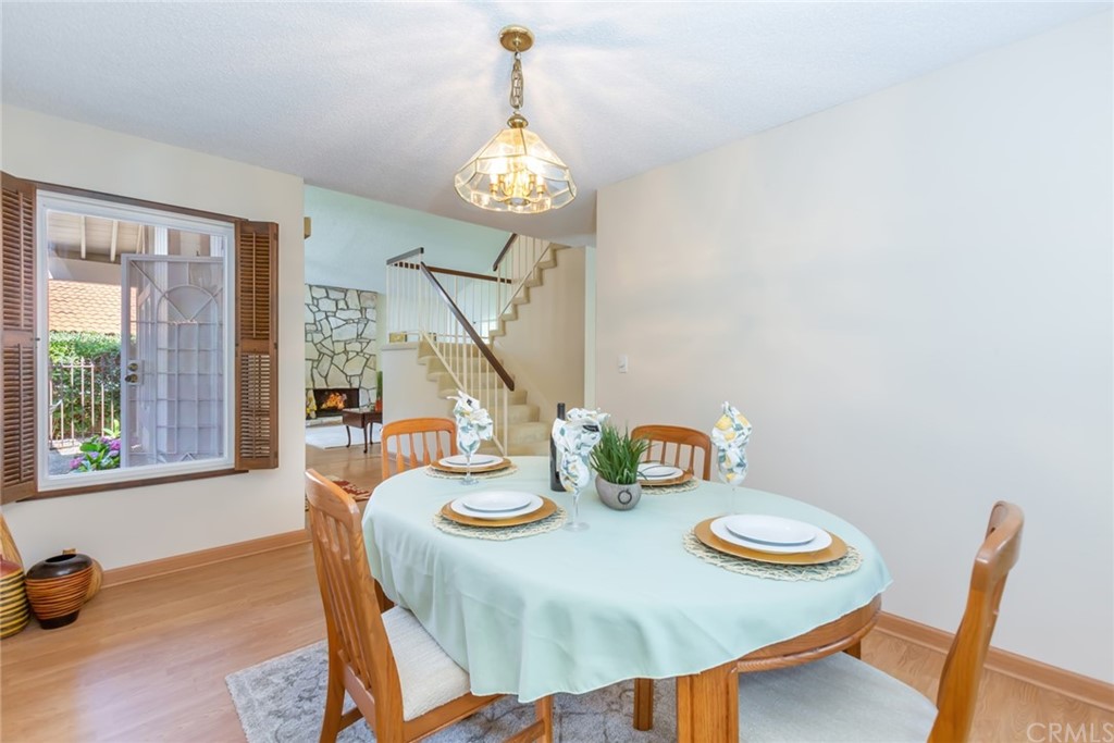 25610 Fallenleaf Drive Torrance, CA 90505 - Photo 21 of 49 a view of a dining room with furniture a chandelier and wooden floor