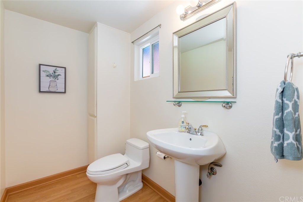 25610 Fallenleaf Drive Torrance, CA 90505 - Photo 22 of 49 a bathroom with a toilet sink and mirror
