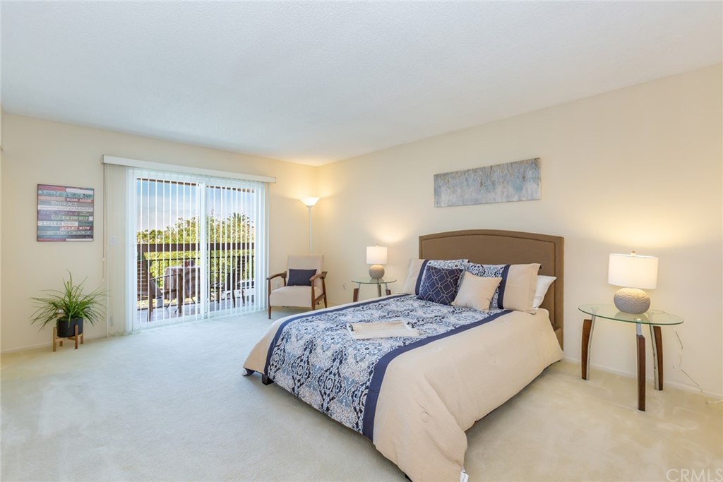 25610 Fallenleaf Drive Torrance, CA 90505 - Photo 25 of 49 a spacious bedroom with a bed and a lamp
