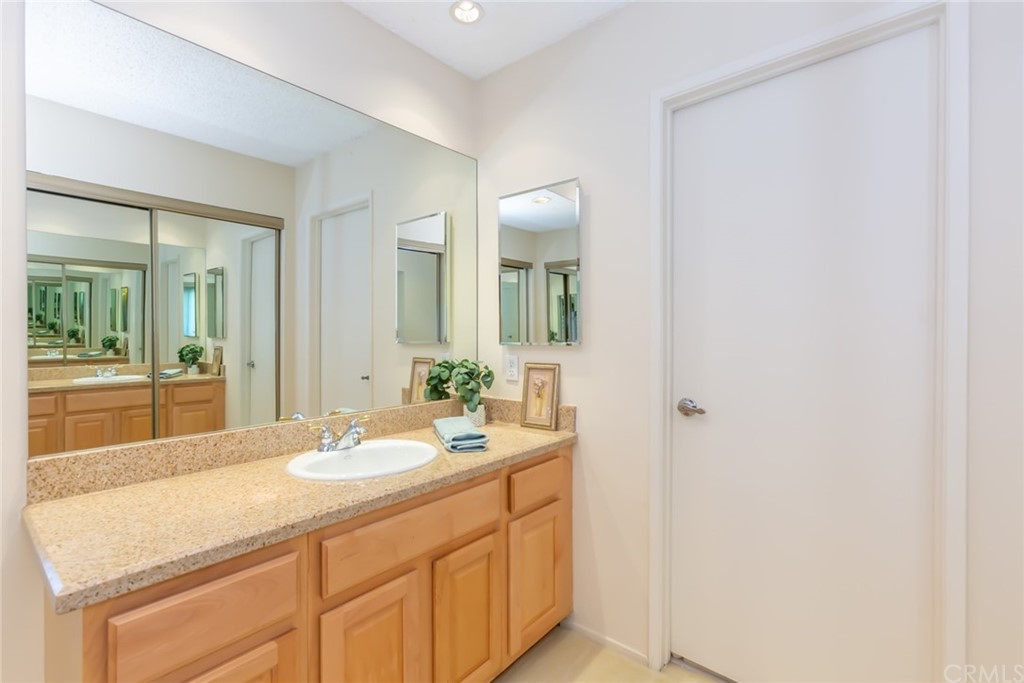 25610 Fallenleaf Drive Torrance, CA 90505 - Photo 30 of 49 a bathroom with a sink and a mirror