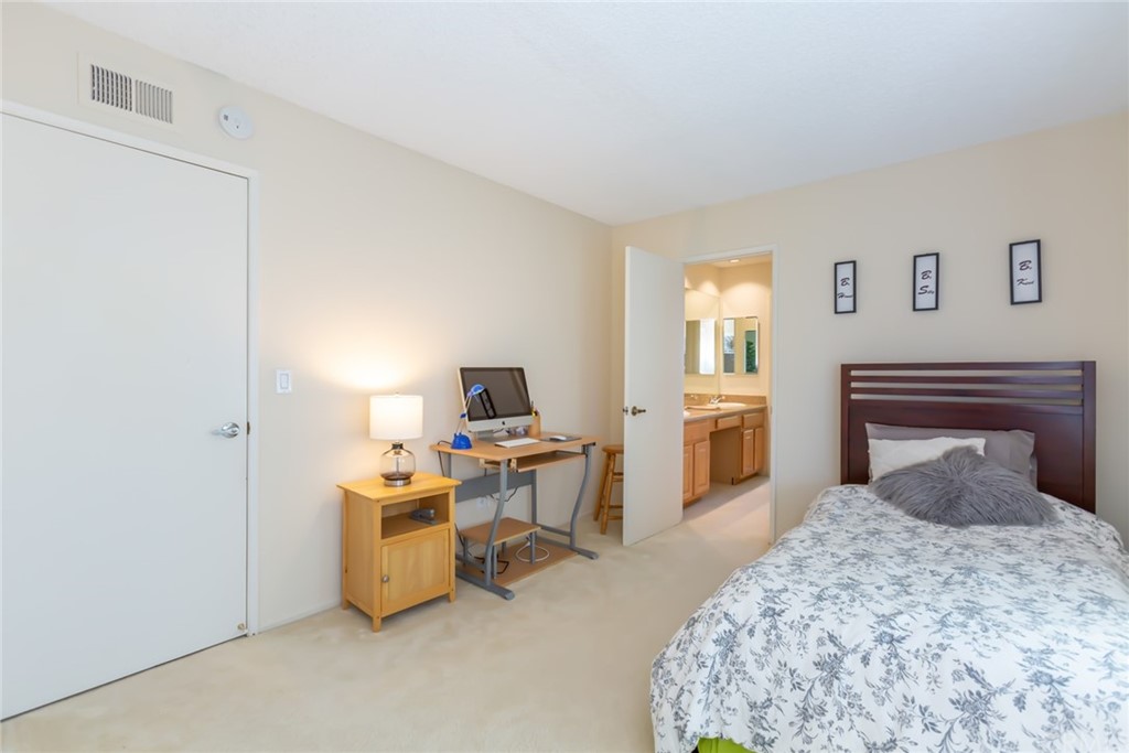 25610 Fallenleaf Drive Torrance, CA 90505 - Photo 35 of 49 a bedroom with a bed and a chandelier