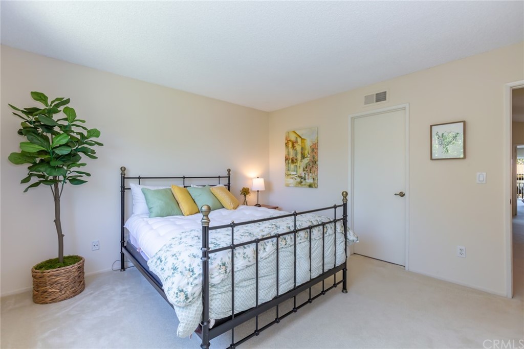 25610 Fallenleaf Drive Torrance, CA 90505 - Photo 39 of 49 a bedroom with a bed and a potted plant