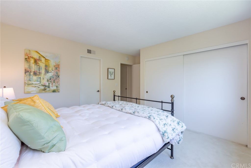 25610 Fallenleaf Drive Torrance, CA 90505 - Photo 40 of 49 a bedroom with a bed and a painting on the wall