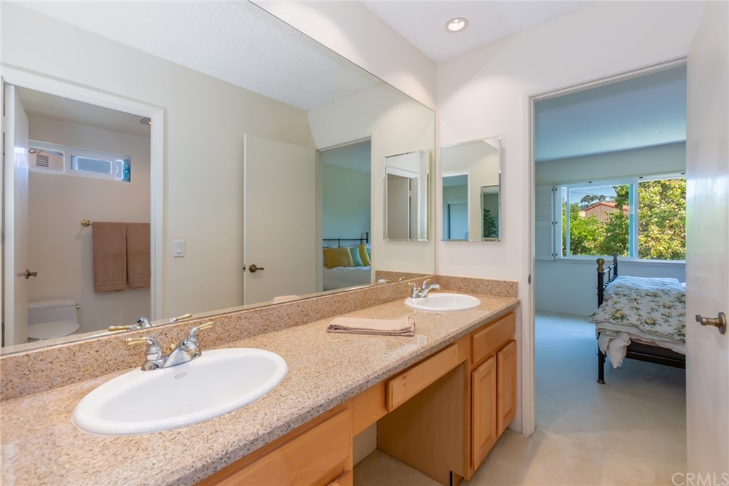 25610 Fallenleaf Drive Torrance, CA 90505 - Photo 41 of 49 a bathroom with a granite countertop sink and a mirror