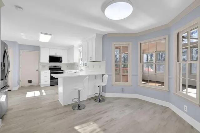 a bathroom with a sink vanity and a mirror
