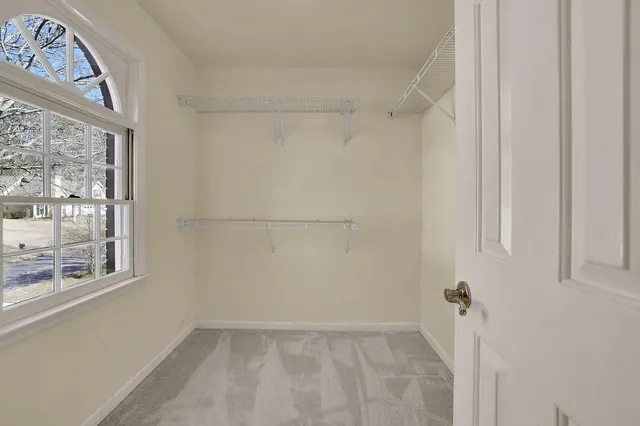 a view of wooden floor and windows in a room
