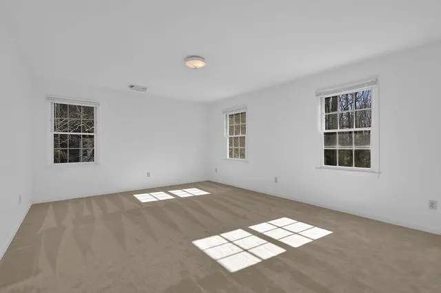 a view of a backyard with sitting area