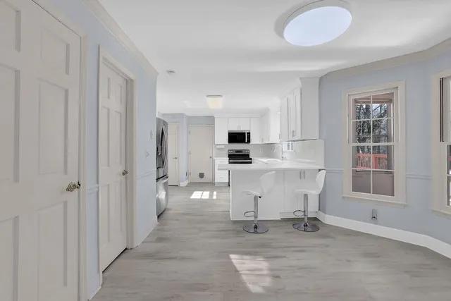 a bathroom with a sink vanity granite and a mirror