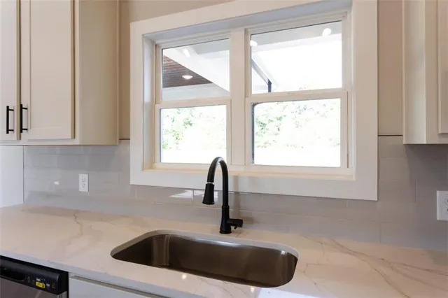 a close view of a sink and a window
