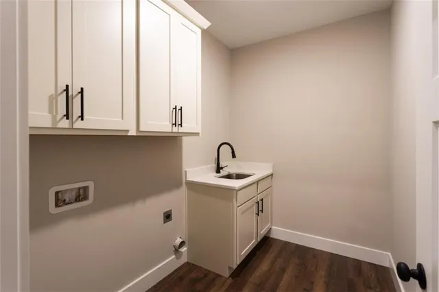 a bathroom with a sink and glass door