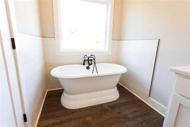 a bathroom with a bathtub and a shower