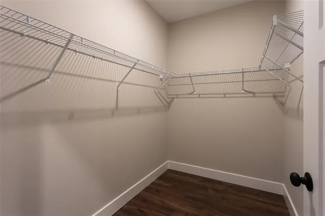 an empty room that has a window in it