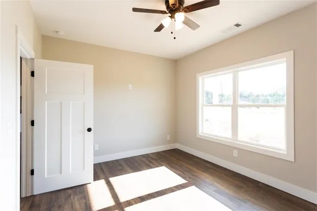 a view of a room with gym equipment and windows