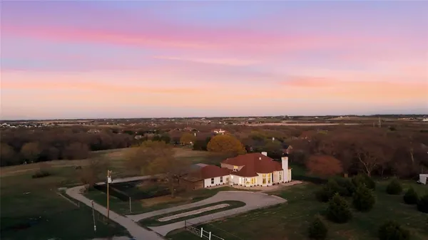 a view of a terrace with a table and chairs