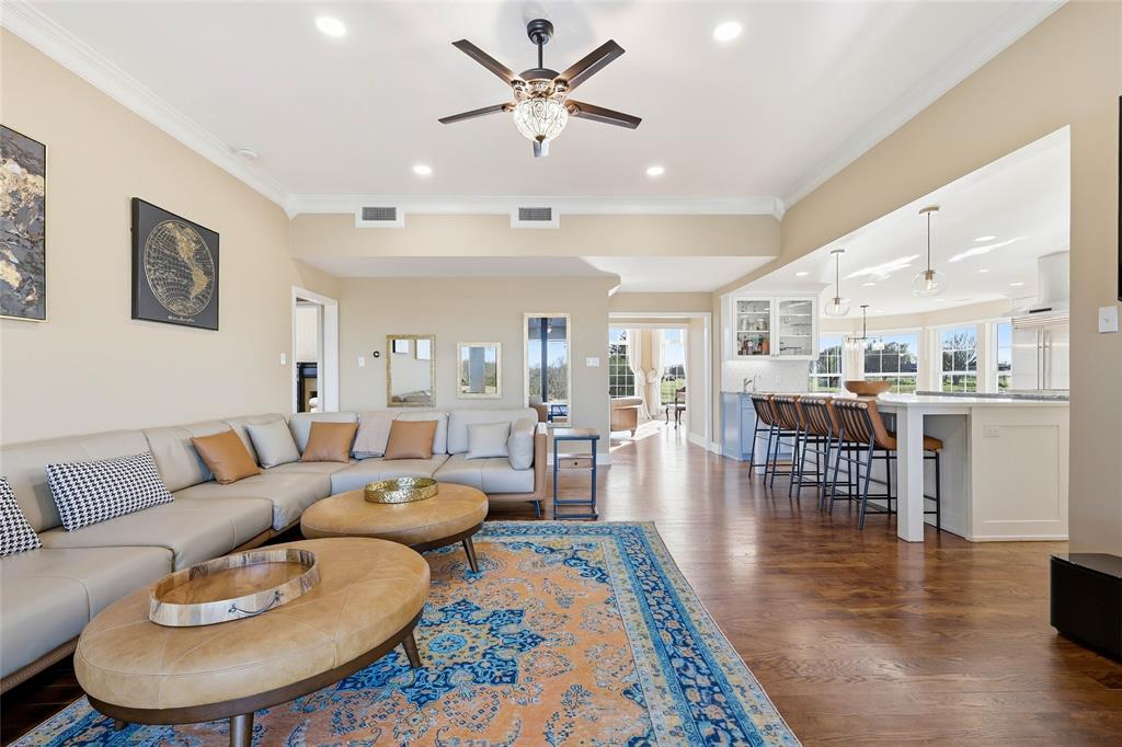 243 South King Road Heath, TX 75126 - Photo 40 of 40 a living room with furniture and a dining table with wooden floor