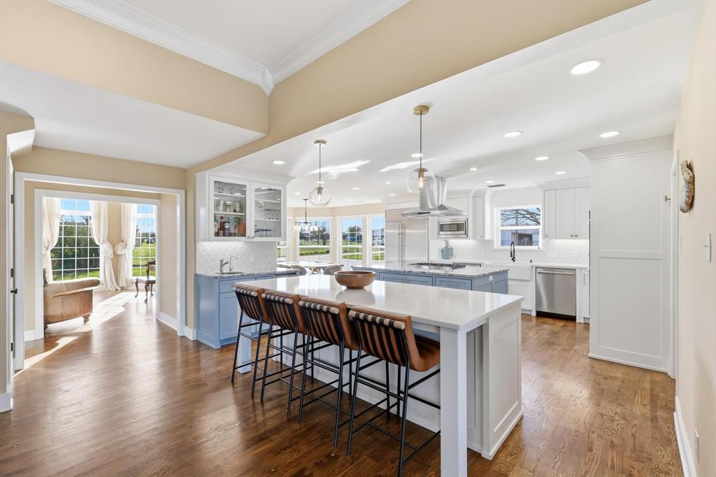 243 South King Road Heath, TX 75126 - Photo 14 of 40 a large kitchen with a table and chairs